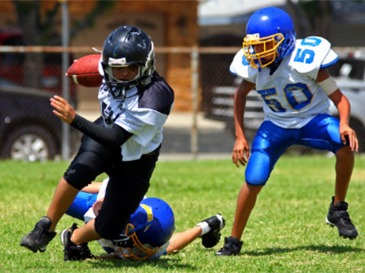 teens playing football